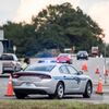 A driver asks a state trooper for directions at an access ramp to I-26. Because of Florence.