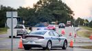 A driver asks a state trooper for directions at an access ramp to I-26. Because of Florence.