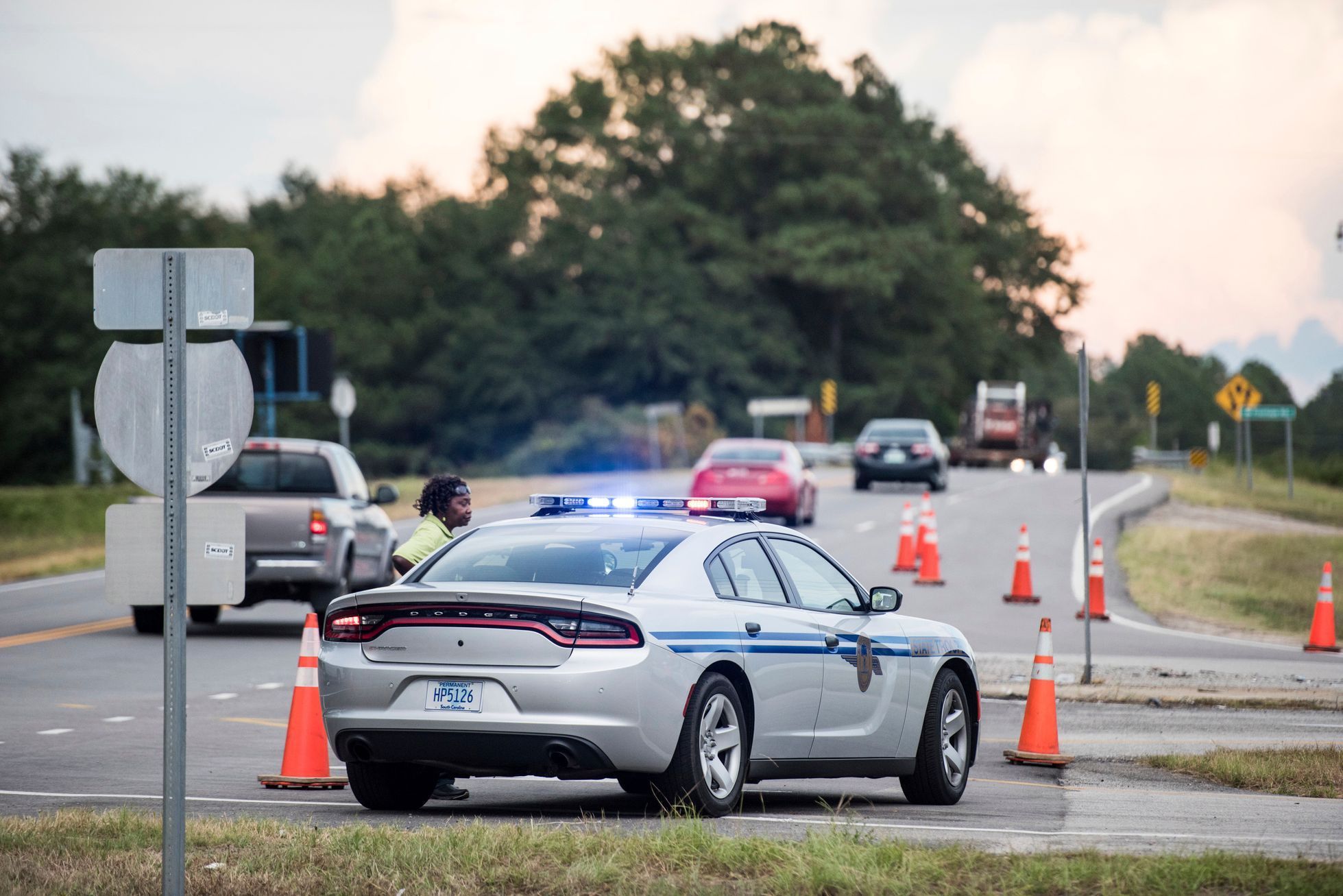A driver asks a state trooper for directions at an access ramp to I-26. Because of Florence.