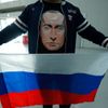 Ruský fanoušek v tričku v Vladimirem Putinem ve čtvrtfinále s Norskem na ZOH 2018
