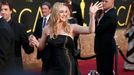 Kate Winslet, nominated for Best Supporting Actress for her role in &quot;Steve Jobs&quot;, wearing a strapless, shiny black Ralph Lauren gown, poses as she arrives at th