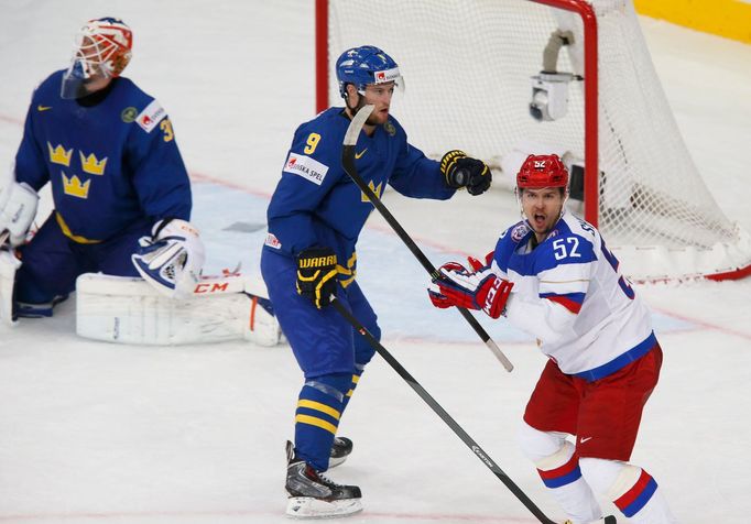 Russia's Sergei Shirokov celebrates his goal as Sweden's goalie Anders Nilsson (L) and Niclas Andersen (C) react during their men's ice hockey World Championship semi-fin