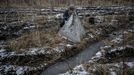 A worker installs razor wire as a part of defence structures near a front line, amid Russia's attack on Ukraine, in the Kharkiv region, Ukraine December 25, 2023. REUTERS