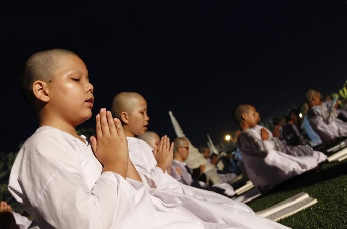 Novice Thai nuns pray at the Sathira Dammasathan Buddhist meditation centre in Bangkok