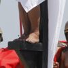 Ruben Enaje, 52, who is portraying Jesus Christ for the 27th time, is closely watched by two men who play Roman soldiers while his feet are nailed to a wooden cross during a Good Friday crucifixion re-enactment in San Pedro Cutud town, Pampanga province, north of Manila March 29, 2013. The Roman Catholic church frowns on the gory spectacle held in the Philippine village of Cutud every Good Friday but does nothing to deter the faithful from emulating the suffering of Christ and taking a painful route to penitence. Holy Week is celebrated in many Christian traditions during the week before Easter. REUTERS/Romeo Ranoco (PHILIPPINES - Tags: RELIGION SOCIETY) Published: Bře. 29, 2013, 8:11 dop.