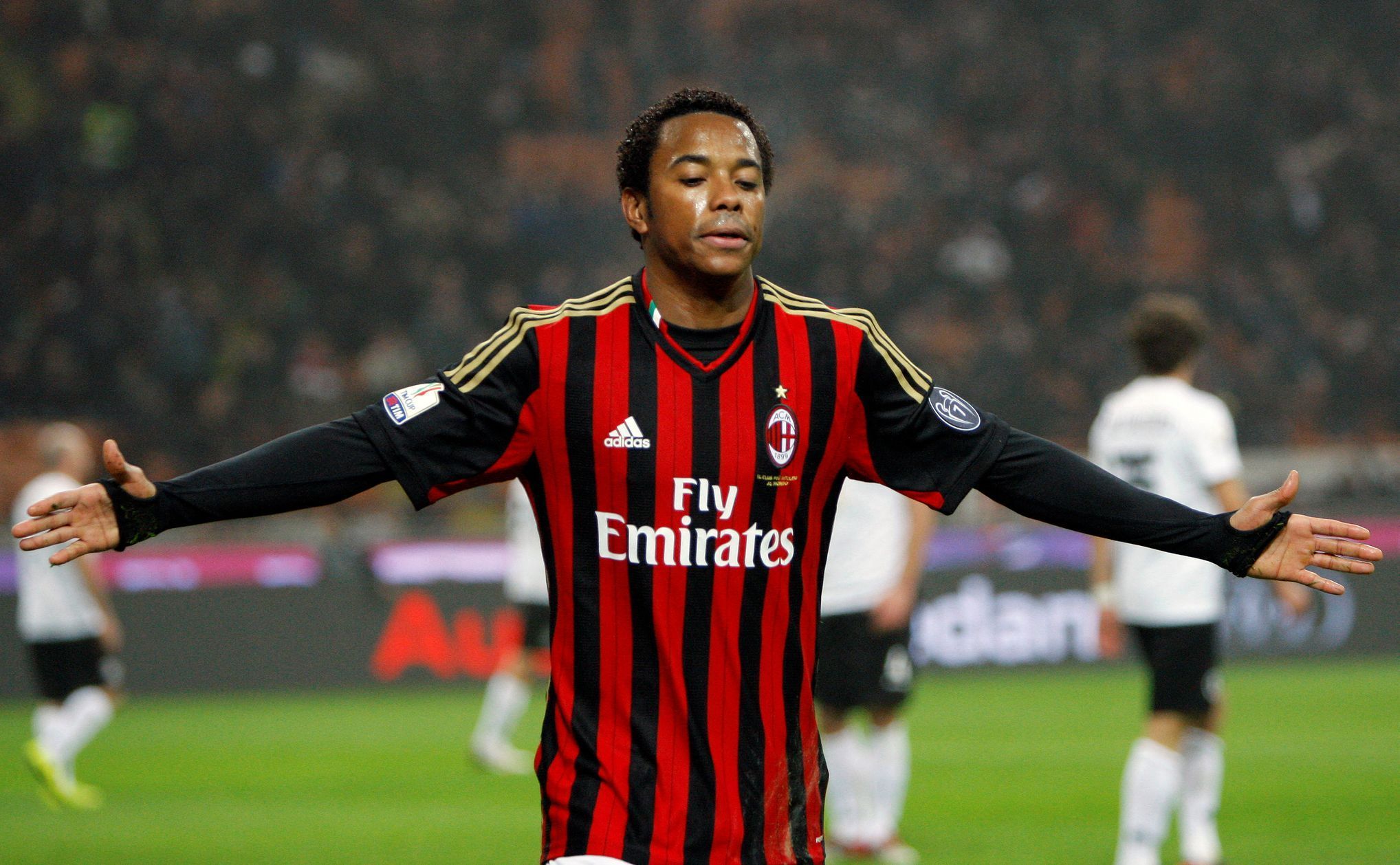 FILE PHOTO: AC Milan's Robinho celebrates after scoring against Spezia during their Italian Cup match in Milan
