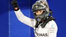 Mercedes Formula One driver Nico Rosberg of Germany celebrates after taking pole position at the qualifying session of the Bahrain F1 Grand Prix at the Bahrain Internatio