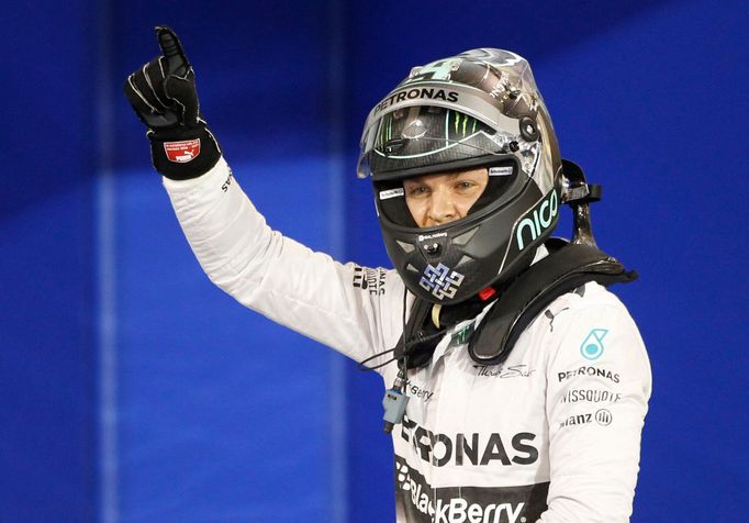 Mercedes Formula One driver Nico Rosberg of Germany celebrates after taking pole position at the qualifying session of the Bahrain F1 Grand Prix at the Bahrain Internatio