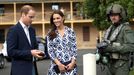 Catherine, the Duchess of Cambridge, and her husband Britain's Prince William (L) prepare to board a Royal Australian Navy MRH90 helicopter at Sydney's Victoria Barracks