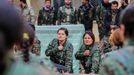 Female fighters of the Kurdish People's Protection Units (YPG) take part in an oath-taking ceremony at a military camp in Ras a-Ain January 30, 2015. Picture taken Januar