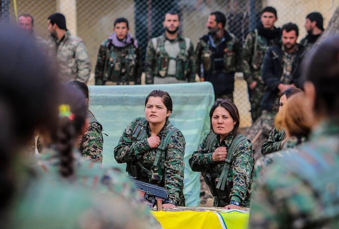 Female fighters of the Kurdish People's Protection Units (YPG) take part in an oath-taking ceremony at a military camp in Ras a-Ain January 30, 2015. Picture taken Januar