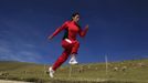 Marathon runner Gladys Tejeda, the first Peruvian athlete who qualified for the 2012 London Olympic Games, runs during her training in the Andean province of Junin May 14, 2012. A private company will take Tejeda's mother Marcelina Pucuhuaranga, 69, to London as part of the "Thank you Mom" program. For Pucuhuaranga, who received her first passport, it will be the first time travelling out of Peru. The program will take about 120 mothers of different athletes around the world to attend the games. Tejeda, the youngest of nine children, returned to her hometown to visit her mother and to focus on training where she will run more than 20 km every day in the highlands (over 4,105 meters above sea level). Picture taken May 14, 2012. REUTERS/Pilar Olivares (PERU - Tags: SPORT ATHLETICS OLYMPICS TPX IMAGES OF THE DAY) Published: Kvě. 17, 2012, 5:44 odp.