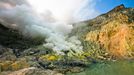 To go with story Indonesia-volcano-mine by Jerome Rivet A picture taken on April 26, 2010 shows Indonesian sulphur miner carrying blocks of sulphur down the Kawah Ijen, o