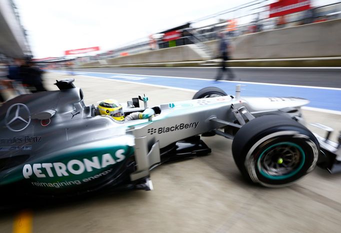 Mercedes Formula One driver Nico Rosberg of Germany exits his garage during the second practice session for the British Grand Prix at the Silverstone Race circuit, centra