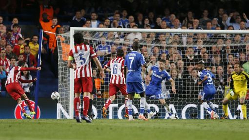 Atletico Madrid's Adrian Lopez (L) scores a goal against Chelsea during their Champion's League semi-final second leg soccer match at Stamford Bridge in London April 30,