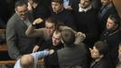 Ukrainan deputies fight during a session of parliament in Kiev February 21, 2014. Fighting broke out between deputies in Ukraine's parliament on Friday when the speaker d