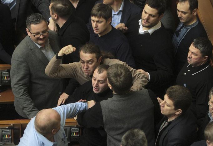 Ukrainan deputies fight during a session of parliament in Kiev February 21, 2014. Fighting broke out between deputies in Ukraine's parliament on Friday when the speaker d