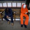 Halloween reveller and other people sleep in the subway early in the morning in the Manhattan borough of New York