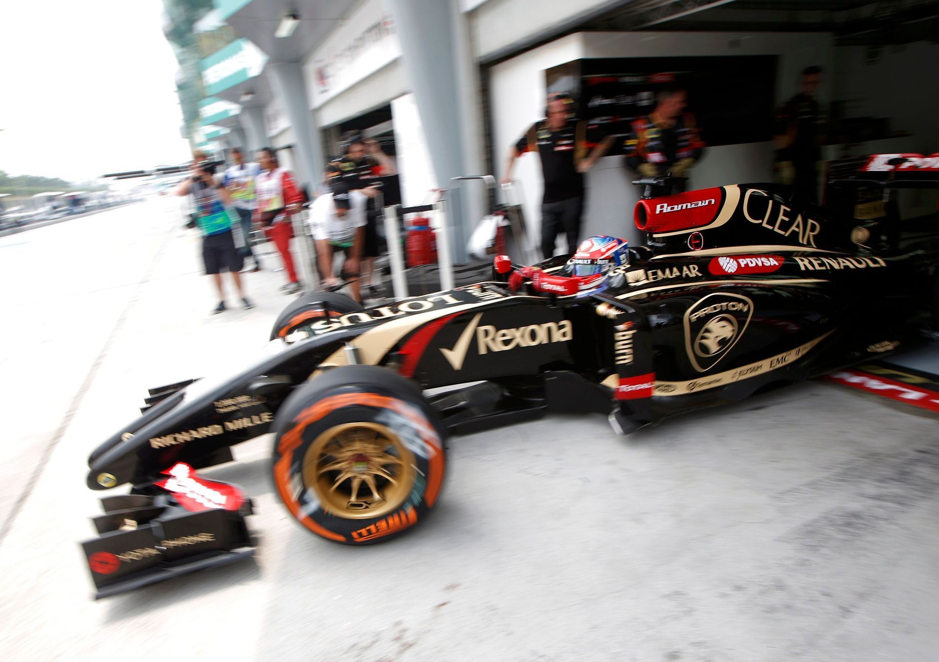 Lotus Formula One driver Grosjean leaves the garage during the second practice session of the Malaysian F1 Grand Prix at Sepang International Circuit outside Kuala Lumpur