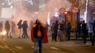 Soccer Football - FIFA World Cup Qatar 2022 - Fans in Brussels watch France v Morocco - Brussels, Belgium - December 14, 2022 A Morocco fan is pictured with a flare after