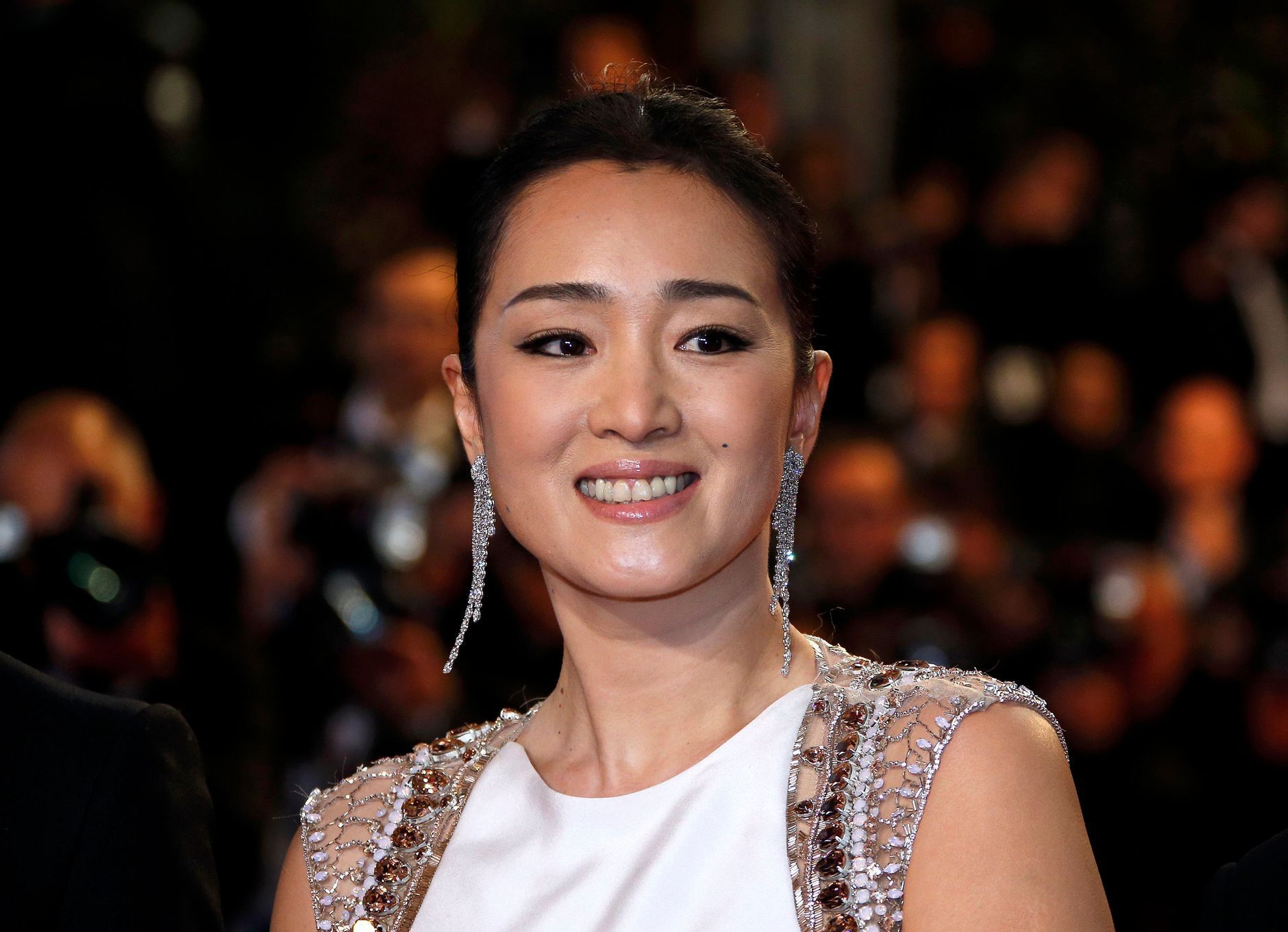 Cast member Gong Li poses on the red carpet as she arrives for the screening of the film &quot;Coming Home&quot; out of competition at the 67th Cannes Film Festival in Cannes