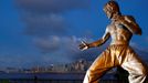 The staue of martial arts artist Bruce Lee is seen in front of the skyline at the Tsim Sha Tsui waterfront in Hong Kong, China, August 27, 2019. REUTERS/Kai Pfaffenbach