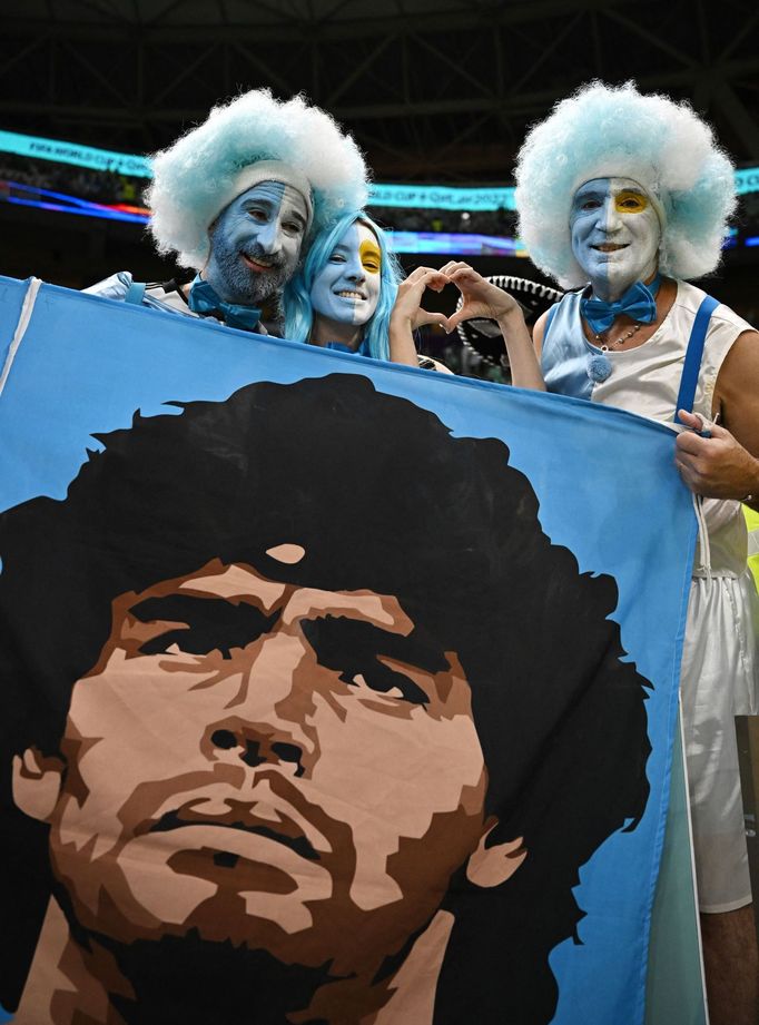 Soccer Football - FIFA World Cup Qatar 2022 - Group C - Argentina v Mexico - Lusail Stadium, Lusail, Qatar - November 26, 2022 Argentina fans hold a banner displaying Die