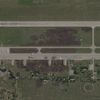 FILE PHOTO: Satellite view shows damaged planes and tarmac at Russian Belaya airfield
