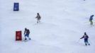 Skiers inspect the moguls piste at the "Extreme-Park" of Rosa Khutor, a venue for the Sochi 2014 Winter Olympics near Sochi February 14, 2013. The Sochi 2014 Winter Olympics opens on February 7, 2014. REUTERS/Kai Pfaffenbach (RUSSIA - Tags: SPORT OLYMPICS) Published: Úno. 14, 2013, 7 odp.