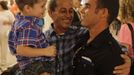 Luis Salgado (R), nicknamed Chucho, is reunited after ten years with his father, Jesus Salgado (C), and his half brother Kevin, after Luis arrived from Havana at Miami airport, March 13, 2013. Chucho was granted a U.S. visa based on his father's status as legal resident in Texas, and he was reunited in Miami with his father, who had escaped Cuba on a frail boat ten years earlier. The Salgados are among many Cubans taking advantage of Cuba's new travel policy in place since last January, which allows citizens to leave the country with just a passport and no need for much-hated exit visas required since 1961. Picture taken March 13, 2013. REUTERS/Desmond Boylan (UNITED STATES - Tags: POLITICS SOCIETY) Published: Dub. 11, 2013, 1:28 odp.