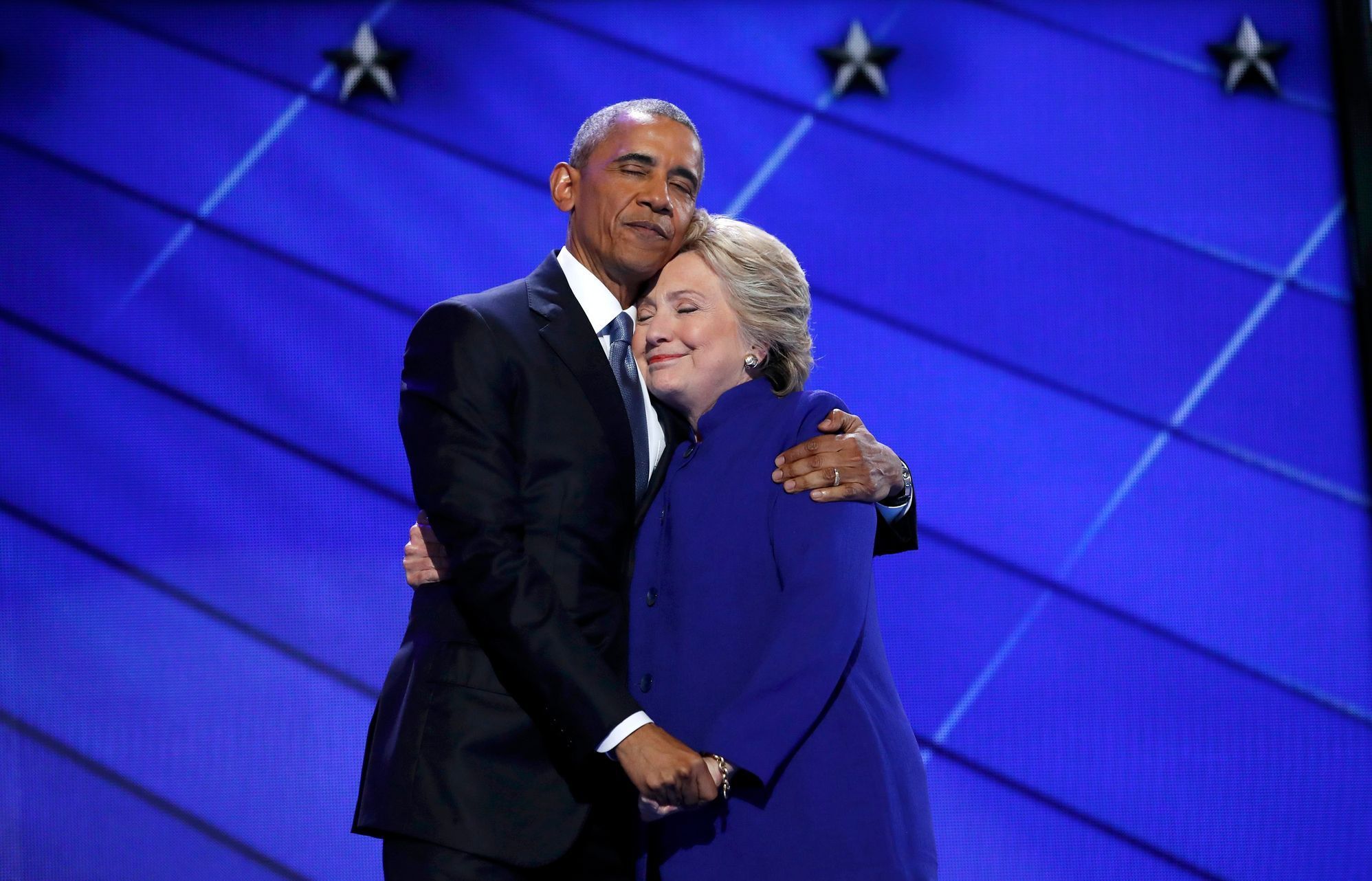 Democratic presidential nominee Clinton hugs U.S. President Obama as she arrives onstage at the end of his speech on the third night of the 2016 Democratic National Convention in Philadelphia