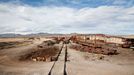 popis: Train cemetery, Uyuni, Bolivia - Apr 2012 2012-04-15 00:00:00 Mandatory Credit: Photo by Stefan Jeremiah / Rex Features (1823223s) Rust In Peace Sitting 3,670 metres above sea level on the edge of the world's largest salt flat are a group of rusted locomotives that once represented the cutting edge of Victorian engineering. Towards the end of the 19th century British engineers were tasked with helping build railway networks all over South America. And when it came to investing in a good transport network the Bolivian Government relied on British expertise. Today, Uyuni in southweat Bolivia is the gateway to the spectacular Salar de Uyuni salt flats. However, it is also, and historically has always been, an important transport hub. Towards the end of the 1800s the plan was to turn it into the main distribution centre for trains carrying freshly mined minerals down to the ports on the Pacific Ocean. Construction on the railway began in 1888 and, despite the efforts of local Aymara Indians to sabotage it, ended in 1892. However, technical and geographical difficulties and disputes with neighbouring countries, which ultimately left Bolivia landlocked, all took their toll and the full grand plans for Uyuni were never realised. Instead the mining industry limped on until the 1940s before ultimately collapsing. Rather than being decommissioned and sold as scrap the now redundant locomotives were driven 3km outside of town and dumped in the desert. As the railwaylines fell into disrepair, the weatherbeaten metal carcases were simply left to rot under the hot sun. Today these rusted behemoths form an eerie "train cemetery" - ghostly skeleton of a bygone age. MUST CREDIT PHOTOS BY: Stefan Jeremiah / Rex Features For more information visit http://www.rexfeatures.com/stacklink/IXJAYEVLX