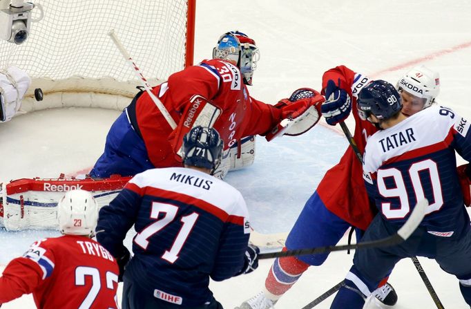 Norway's goalie Lars Haugen (top) fails to save a goal of Slovakia's Tomas Tatar (R) during the first period of their men's ice hockey World Championship group A game at