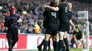 Jerome Kaino of New Zealand (2ndL) celebrates with temmates after scoring a try during their Rugby World Cup Semi-Final match against South Africa at Twickenham in London