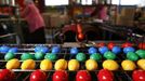 Cooked and coloured eggs are pictured on a conveyor belt at the Beham coloured eggs company in Thannhausen, near Augsburg March 18, 2013. Beham is Bavaria's biggest coloured eggs producer and has stepped up its production to 200,000 eggs per day to meet the high demand ahead of Easter. REUTERS/Michael Dalder (GERMANY - Tags: RELIGION SOCIETY FOOD) Published: Bře. 18, 2013, 12:29 odp.