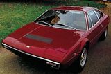 Dino 308 GT4 z roku 1973 je dalším Gandiniho dílem. Pověst říká, že Giugiaro, v té době dvorní návrhář Ferrari, se těžce urazil, když zakázku získal jeho konkurent.