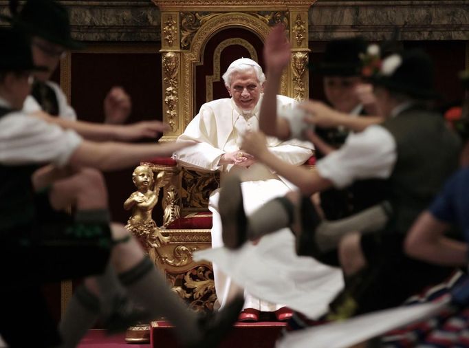 Children dressed in traditional Bavarian costumes dance for Pope Benedict XVI during the Pontiff's 85th birthday celebrations in the Clementine hall at the Vatican