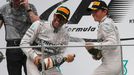 Mercedes Formula One driver Lewis Hamilton of Britain (C) celebrates on the podium with team mate second-placed Nico Rosberg of Germany and team engineer Andrew Shovlin (