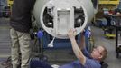 Cessna employee Lynn Redmer works on a nose section of a jet during a tour of the Cessna business jet assembly line at their manufacturing plant in Wichita, Kansas August 14, 2012. One of Cessna Aircraft Company CEO and president Scott Ernes' first moves after joining in May 2011 was to carve Cessna up into five units, each of which run by an executive who was responsible for whether the unit reported a profit or loss. Picture taken August 14, 2012. REUTERS/Jeff Tuttle (UNITED STATES - Tags: TRANSPORT BUSINESS) Published: Srp. 22, 2012, 11:41 dop.