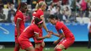 Christine Sinclair (CAN) of Canada and Desiree Scott (CAN) of Canada celebrate victory.