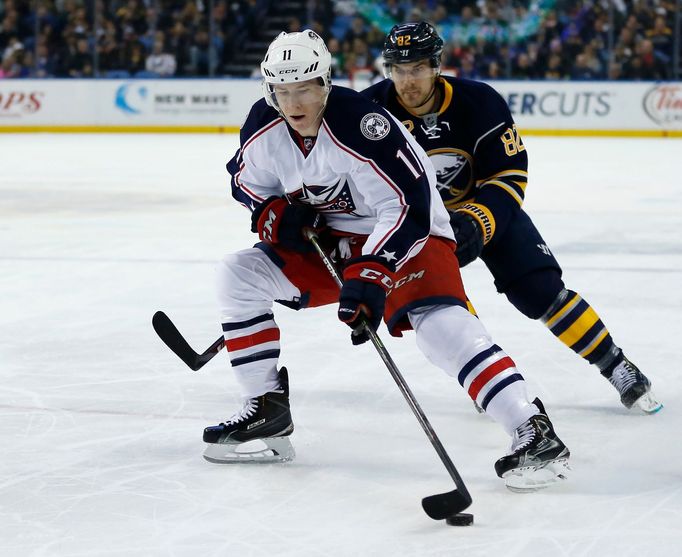 Buffalo Sabres left wing Marcus Foligno (82) pursues Columbus Blue Jackets left wing Matt Calvert (11) during the first period at First Niagara Center