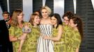 Greta Gerwig (C) poses with guests.