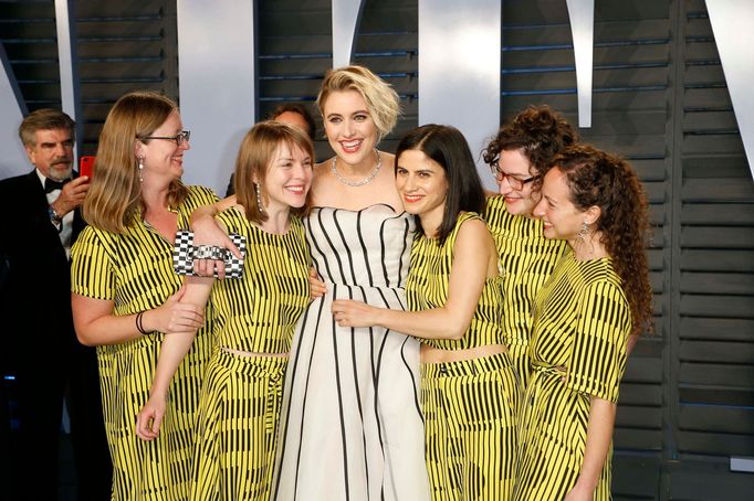 Greta Gerwig (C) poses with guests.