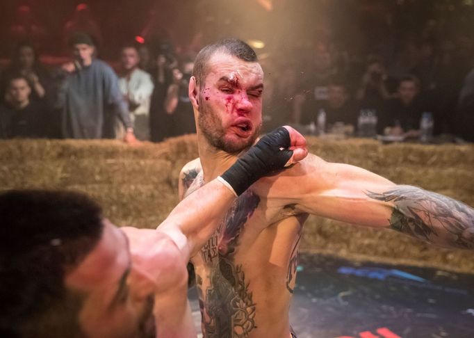 Danik Vesnenok and Danila Utenkov fight during the "Top Dog" bare-knuckle boxing tournament in Moscow, Russia April 16, 2021. Picture taken April 16, 2021. REUTERS/Shamil