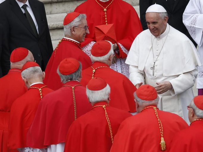 Pope Francis (R) talks with cardinals at the end of a canonization mass in Saint Peter's Square at the Vatican May 12, 2013. The Pope led a mass on Sunday for candidates for sainthood Antonio Primaldo, Mother Laura Montoya and Maria Guadalupe Garcia Zavala.