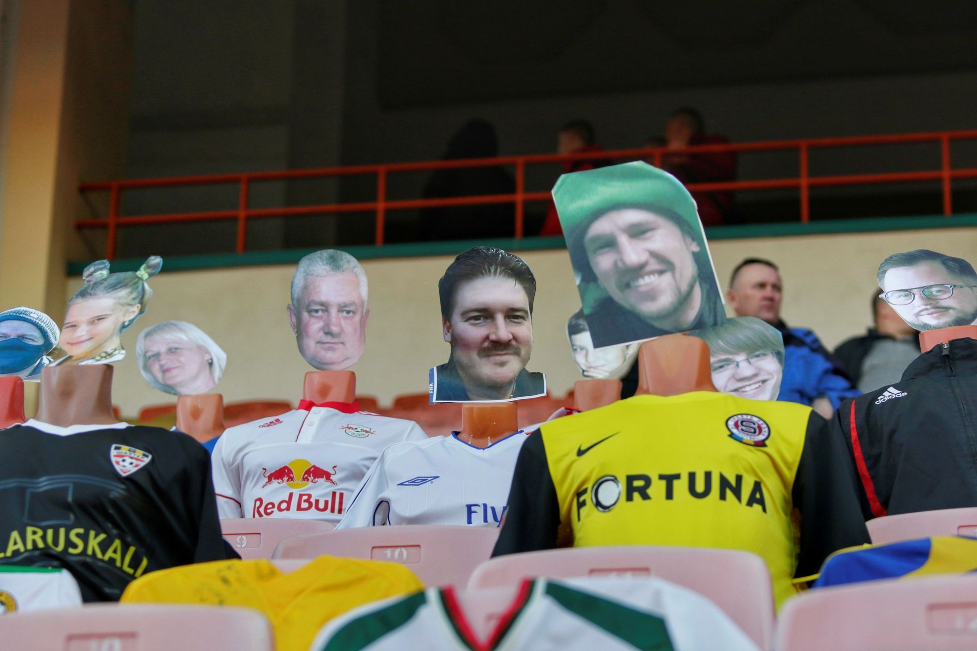 Mannequins dressed in football jerseys with cut-out portraits of fans from different countries are seen in the stands during the match between FC Dynamo Brest and FC Shakhtyor Soligorsk in Brest
