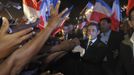 France's President and UMP party candidate for the 2012 French presidential elections Sarkozy shakes hands with supporters on the French indian Ocean island of La Reunion