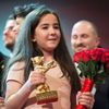 The niece of Iranian film director Panahi appears on stage with jury members and prize winners during awards ceremony at 65th Berlinale International Film Festival in Berlin