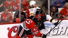 Chicago Blackhawks' Michael Frolik (L) checks Boston Bruins' Andrew Ference during the first period in Game 1 of their NHL Stanley Cup Finals hockey game in Chicago, Illi