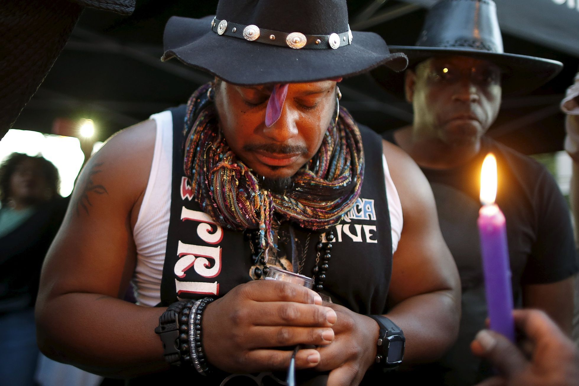 Kenneth Beavers, 49, holds a candle at a vigil to celebrate the life and music of deceased musician Prince in Los Angeles
